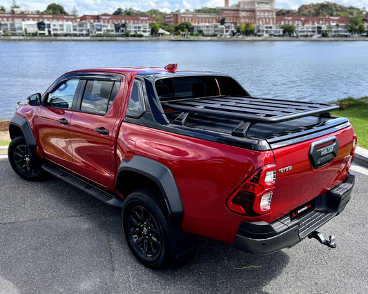 Toyota Hilux Rogue fitted with a tub rack platform overlooking river.