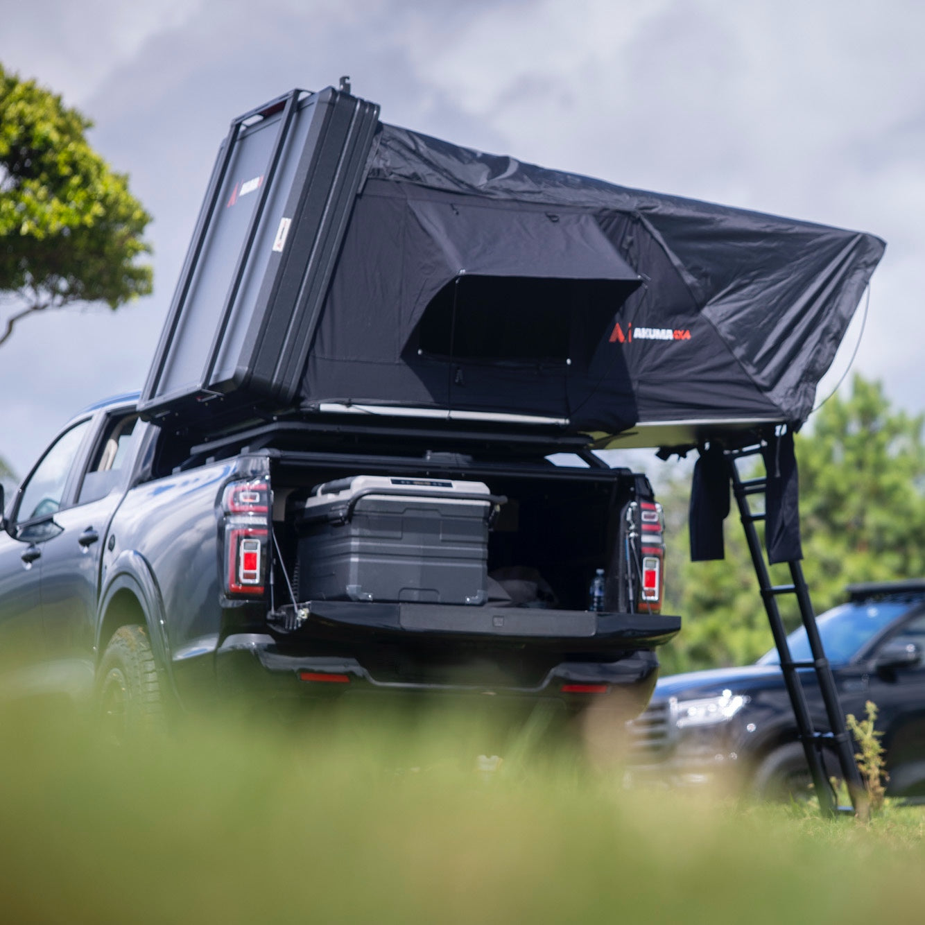 Black version of the K'gari Tub Rack tent with ladder out