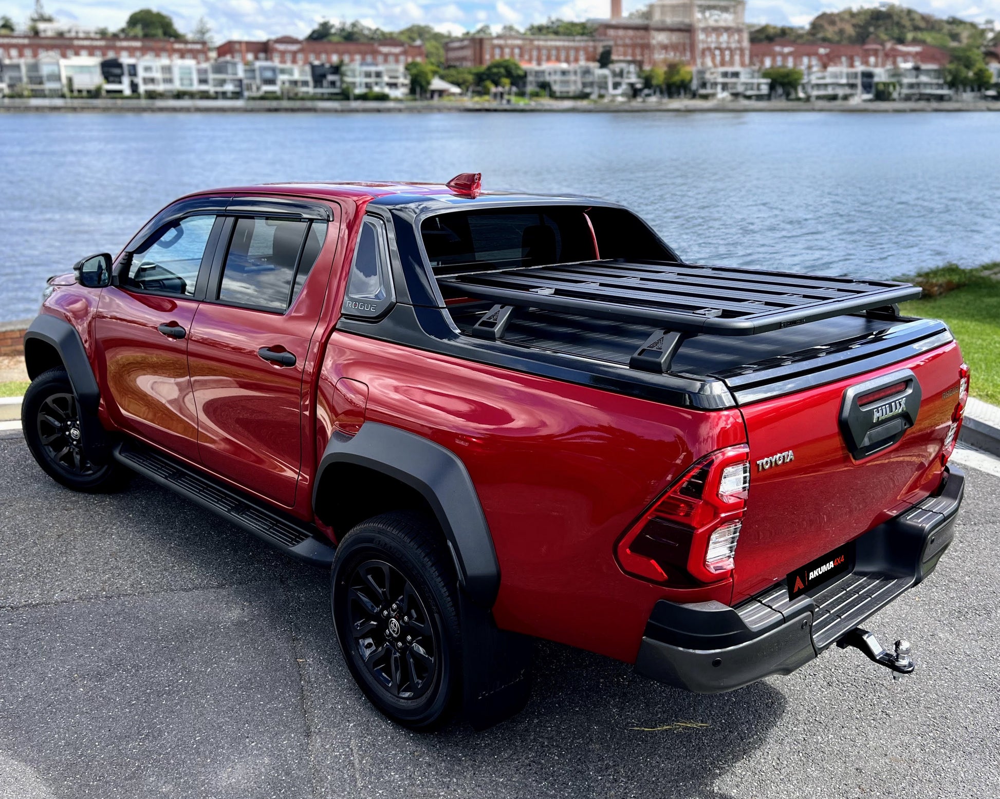 Toyota Hilux Rogue fitted with a tub rack platform overlooking river. 